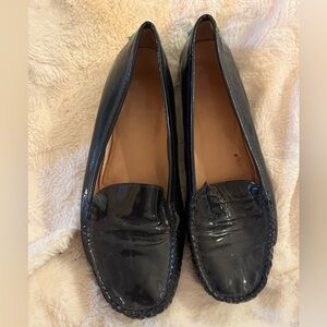Stuart Weitzman black patent leather loafers with green accents